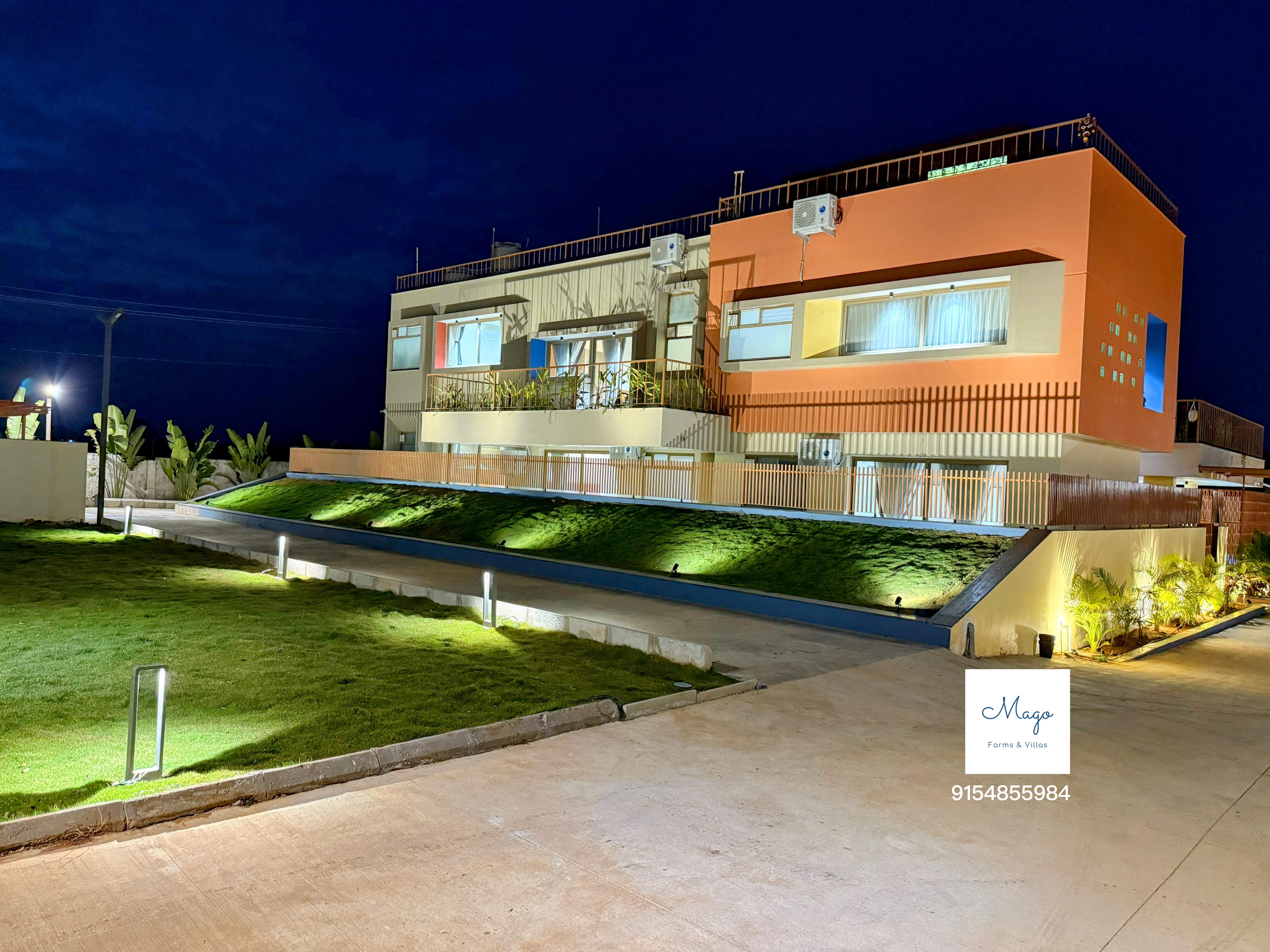 The Terraskye villa and driveway lit up at night
